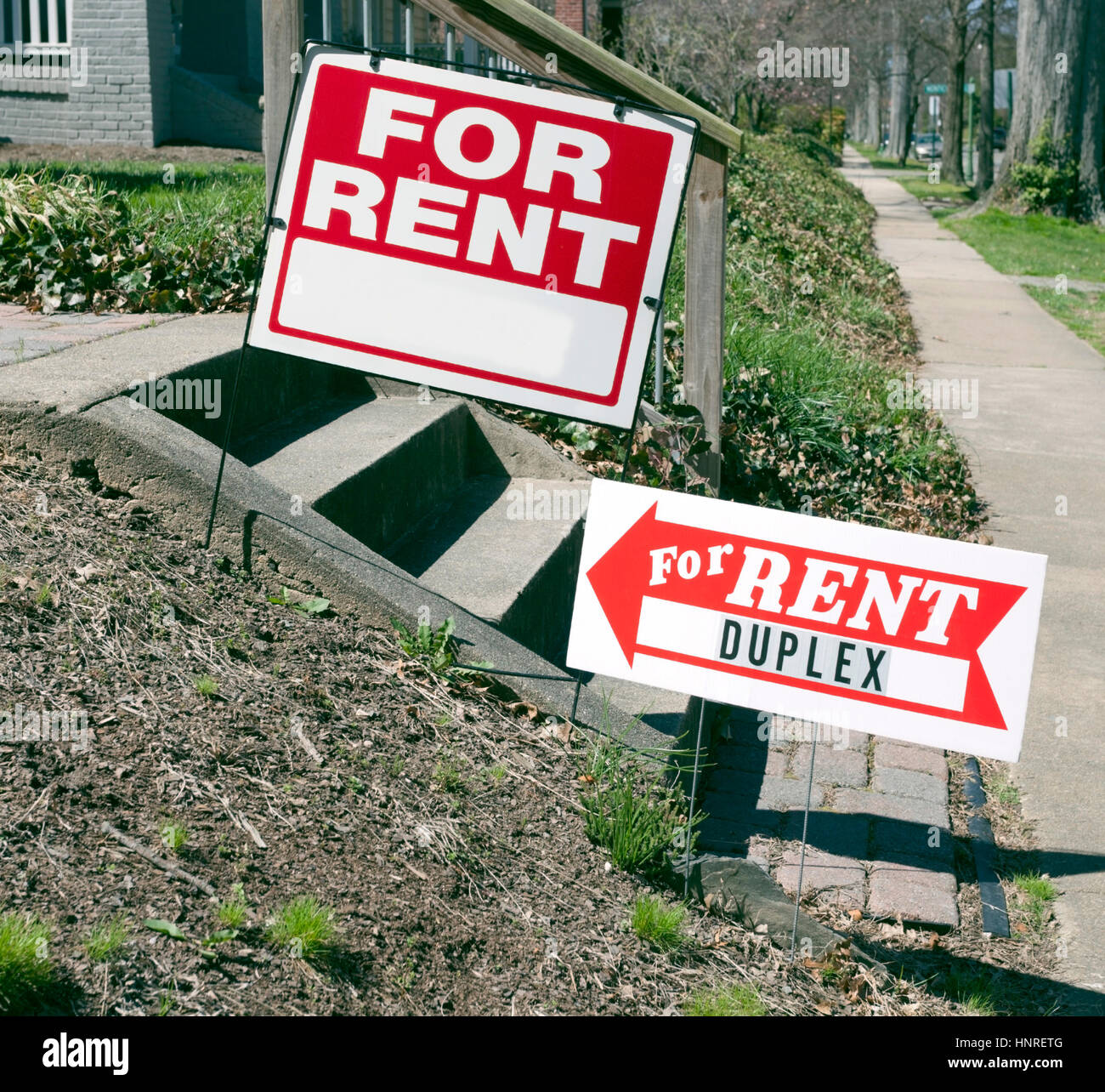 FOR RENT signs on cement steps in neighborhood. Stock Photo