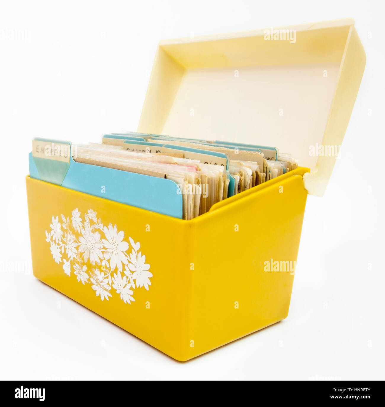 Faded open yellow seventies recipe box. Stock Photo