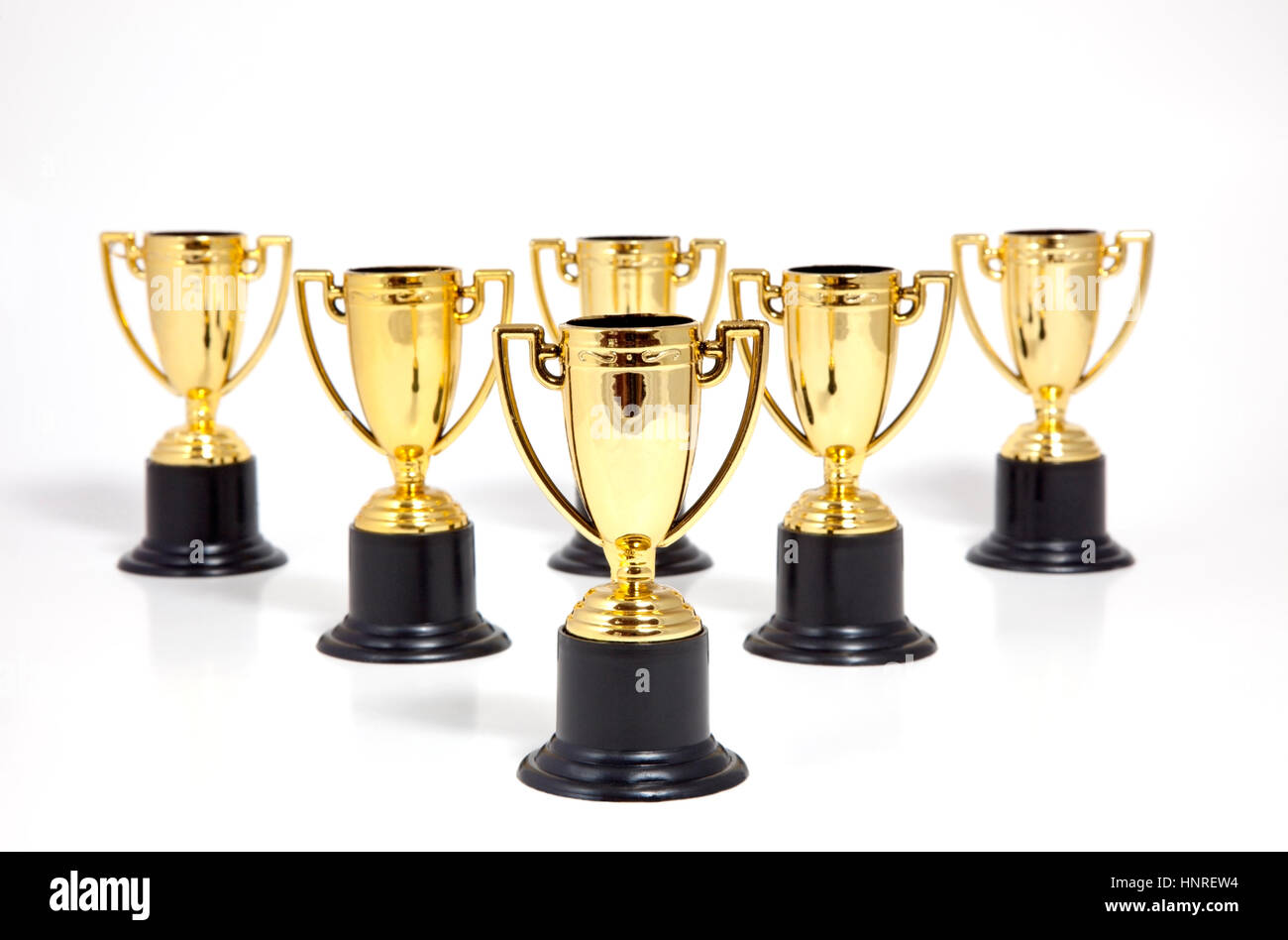 Plastic gold and black award trophies. Stock Photo