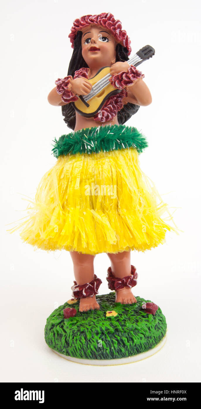 Dashboard hula girl with ukulele. Isolated. Stock Photo