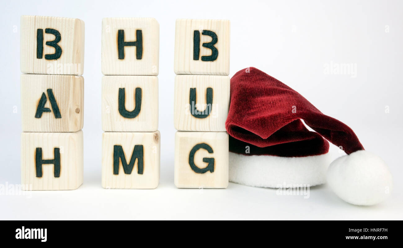 BAH HUMBUG concept presented with toy blocks with Santa hat. Stock Photo
