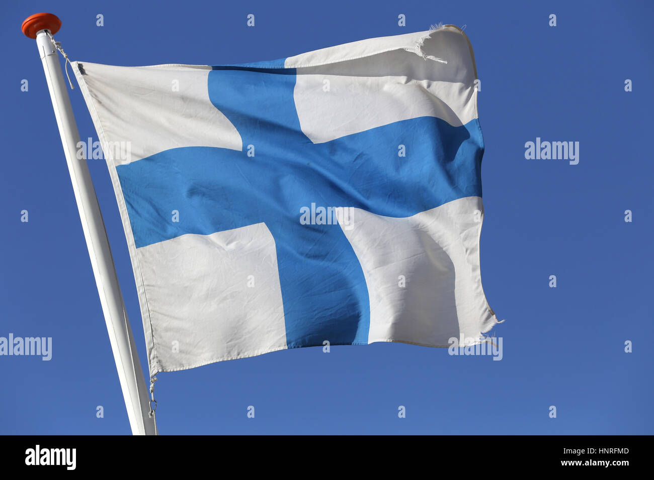 Finnish flag flying in the wind Stock Photo