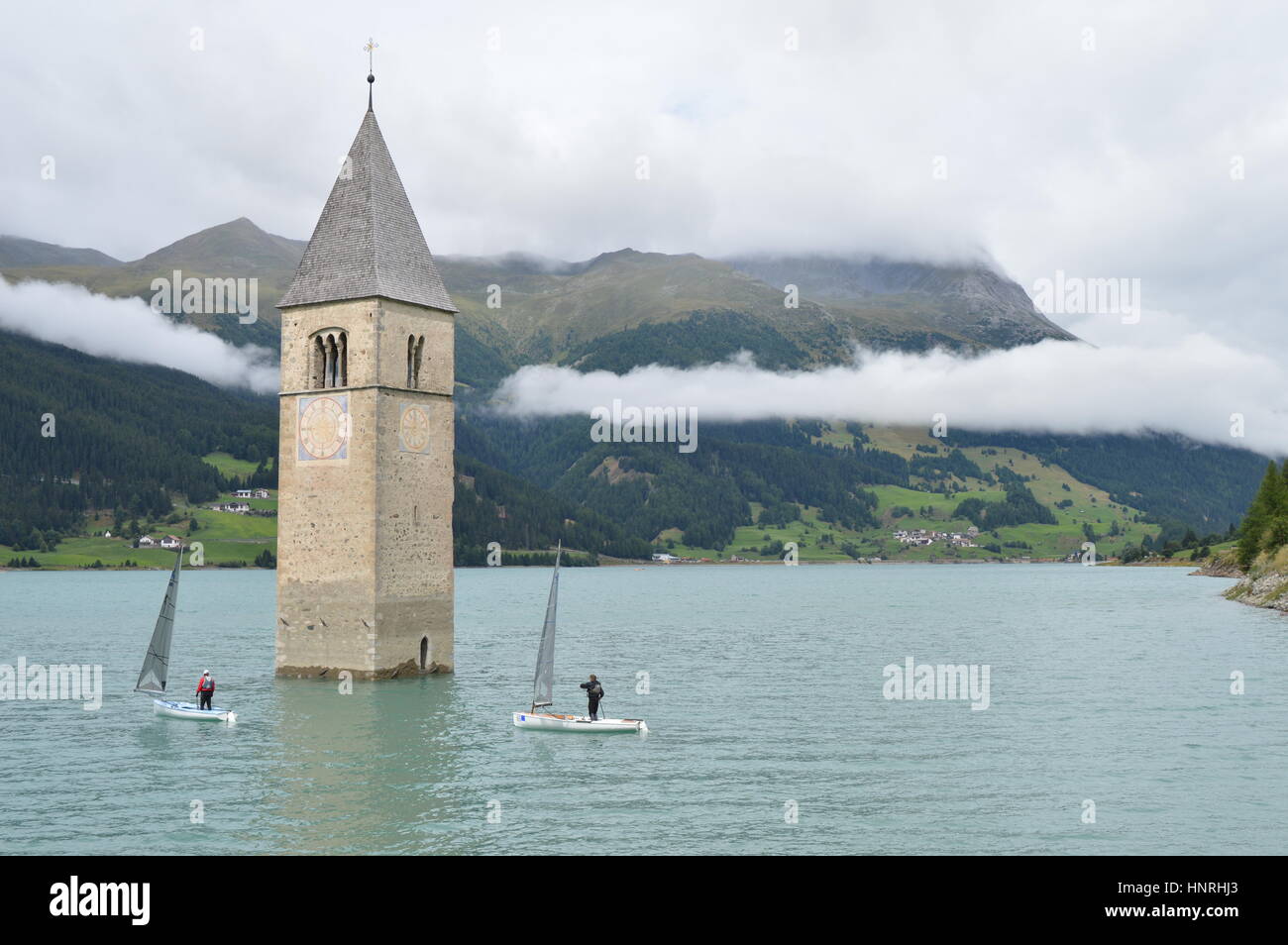 Graun, Italy - August 2, 2015 - 3rd International Open Regatta - Boat race on Rechensee in South Tyrol, Italy, with two sailers Stock Photo