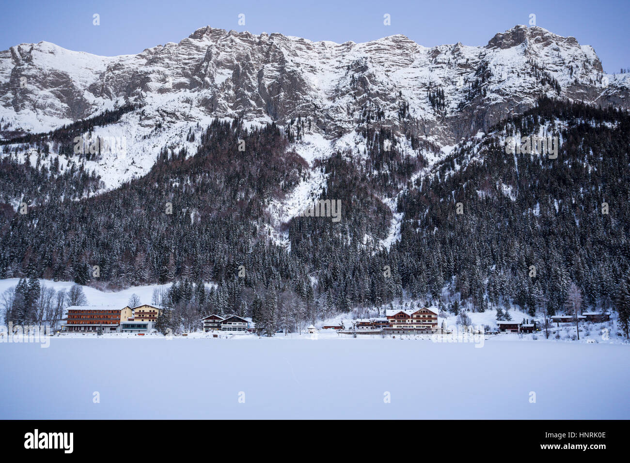 Village in Winter, Hintersee with Mountain in the background, Berchtesgaden, Bavaria, Germany Stock Photo