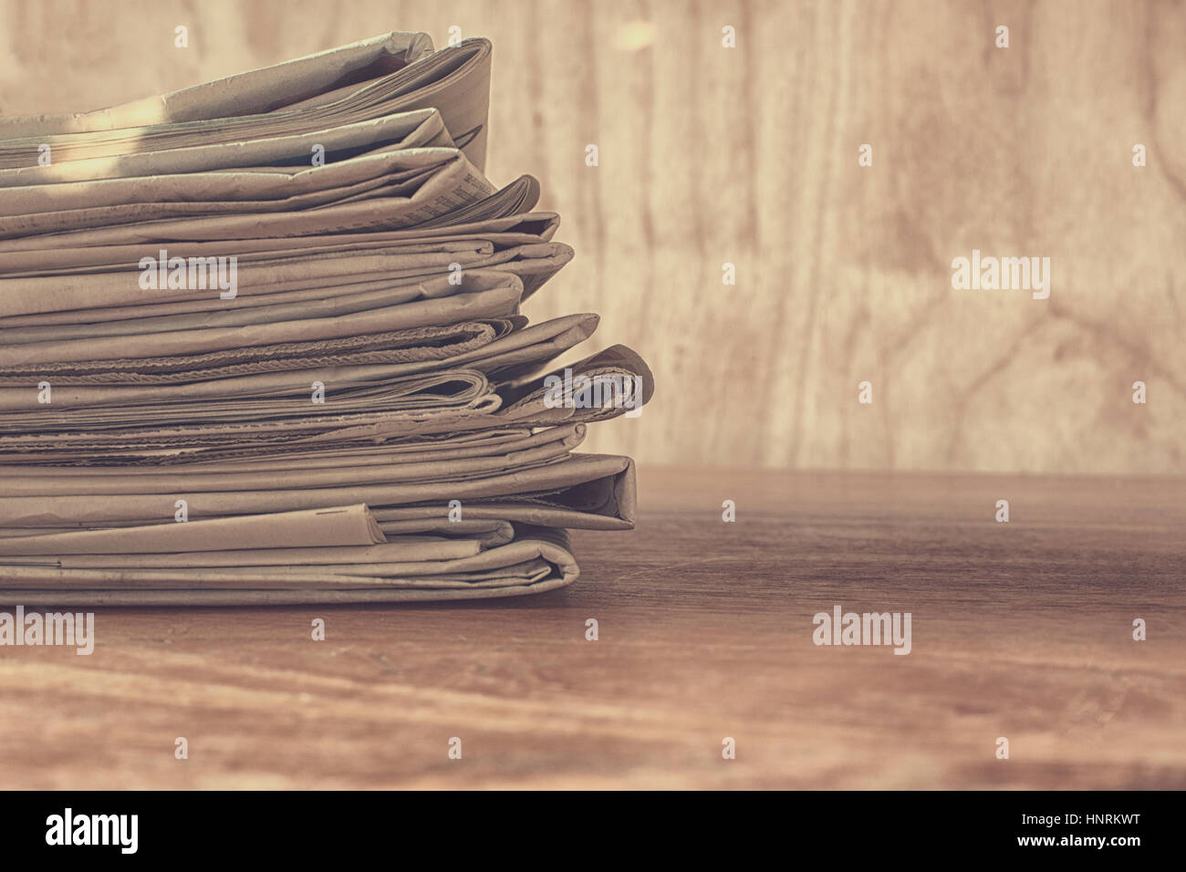 Stack of newspapers on a table Stock Photo