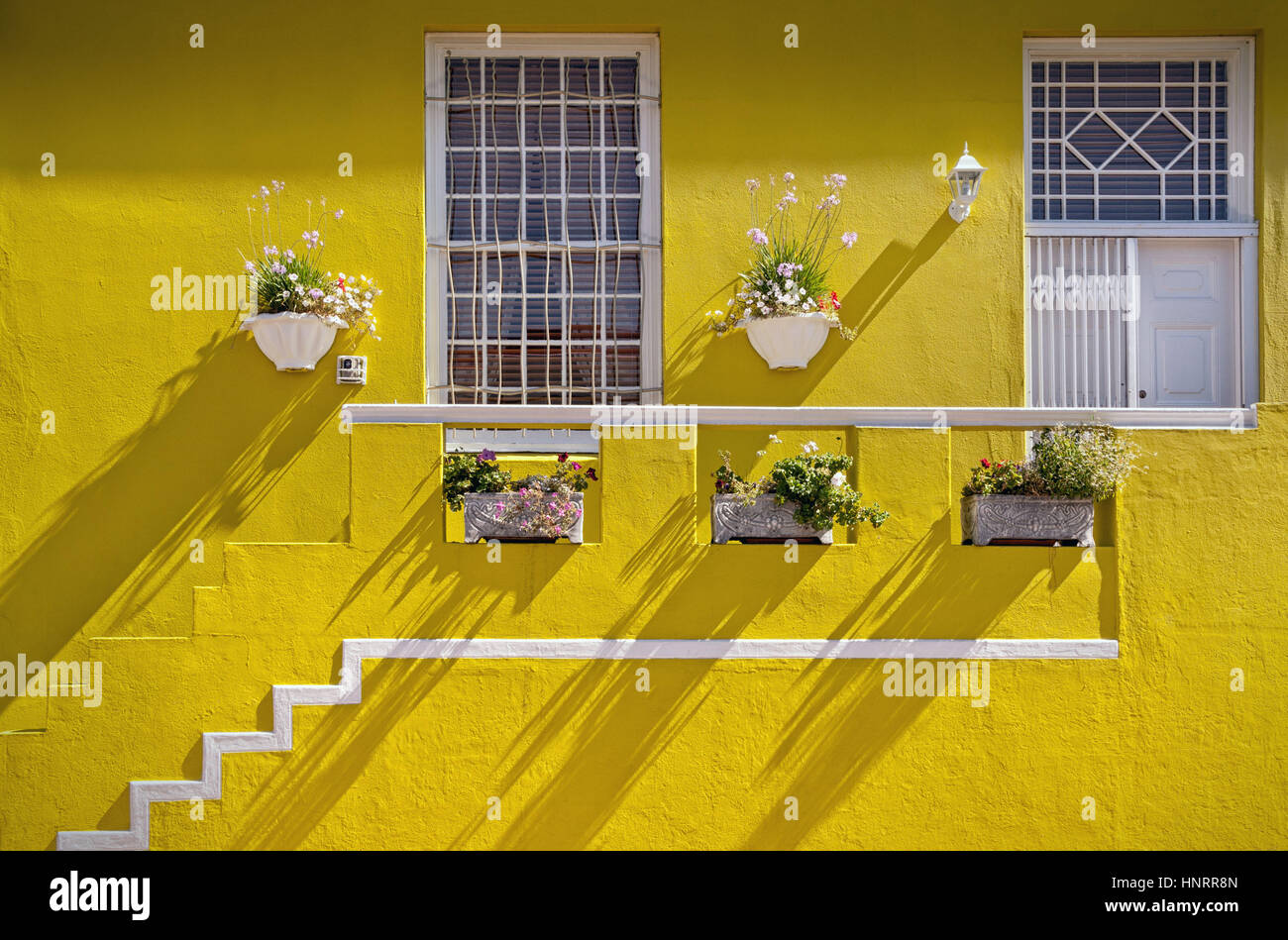 Cape Town, South Africa - Yellow painted house in Muslim Bo Kaap quarter of Cape Town Stock Photo