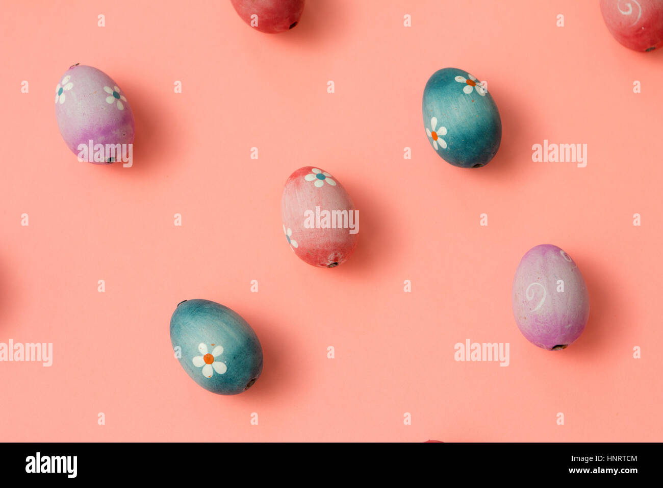 Colourful Easter Eggs ordered on a pink background Stock Photo - Alamy