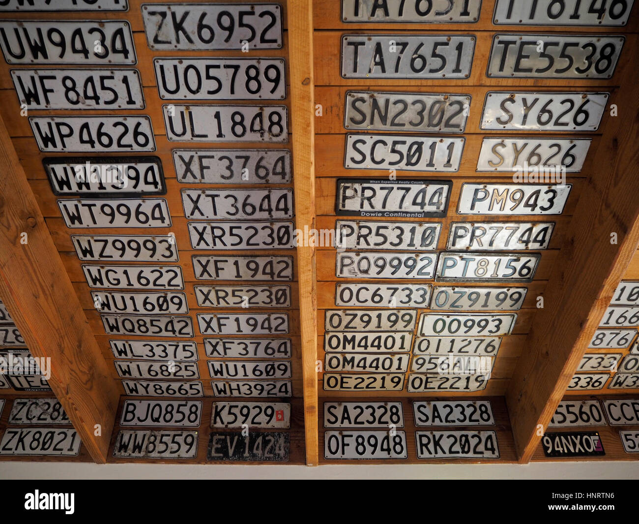Car number plates on the ceiling of The Makarora Country Cafe in New Zealand Stock Photo