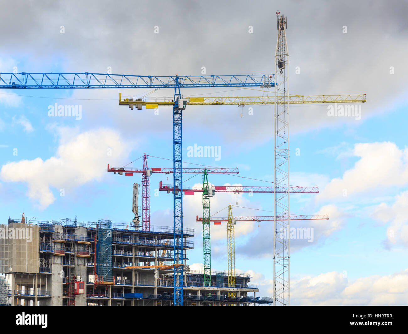 Construction site of concrete and steel skeleton buildings with cranes in the foreground, London, UK Stock Photo