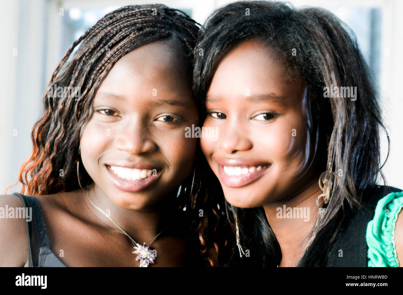 Two young African women in studio setting Stock Photo