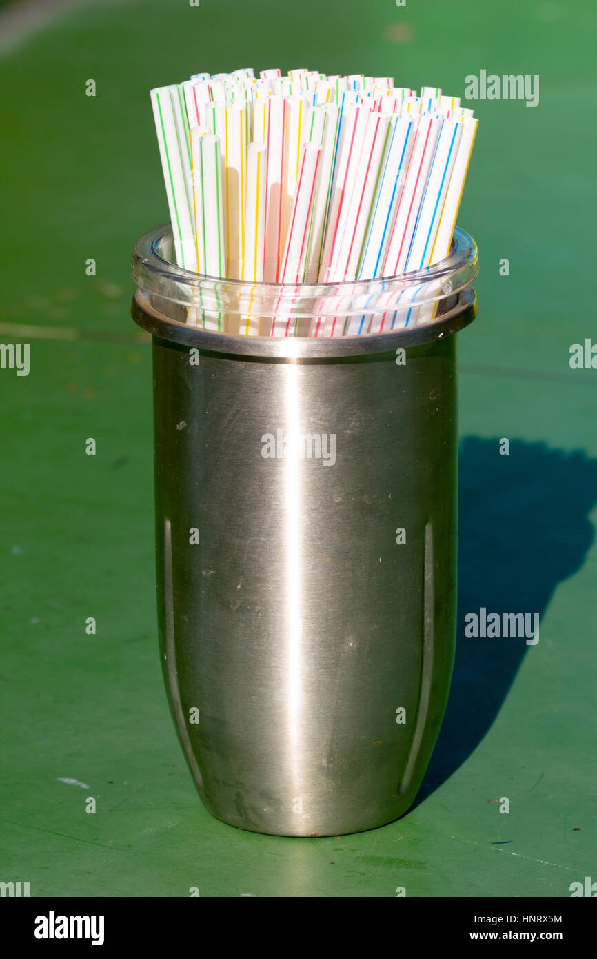 Plastic drinking Straws in container at cafe Stock Photo Alamy