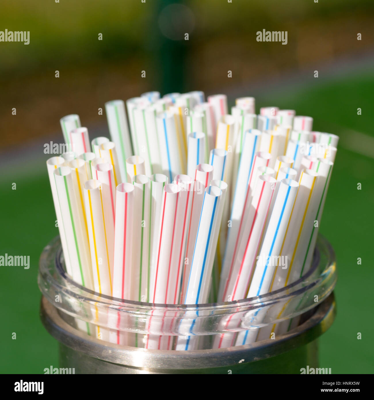 Plastic drinking Straws in container at cafe Stock Photo Alamy