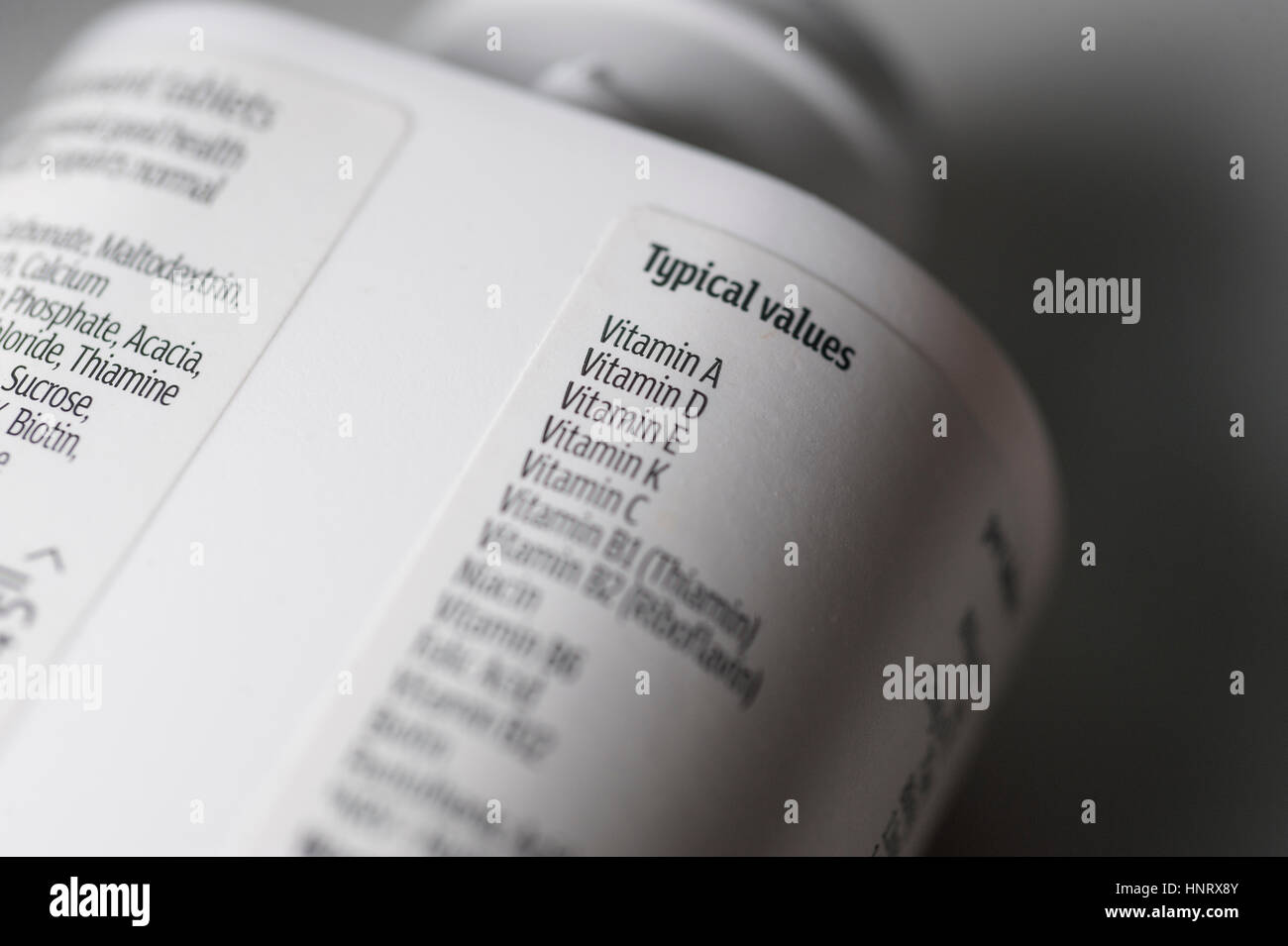 Plastic vitamin supplement bottle label with ingredient list Stock