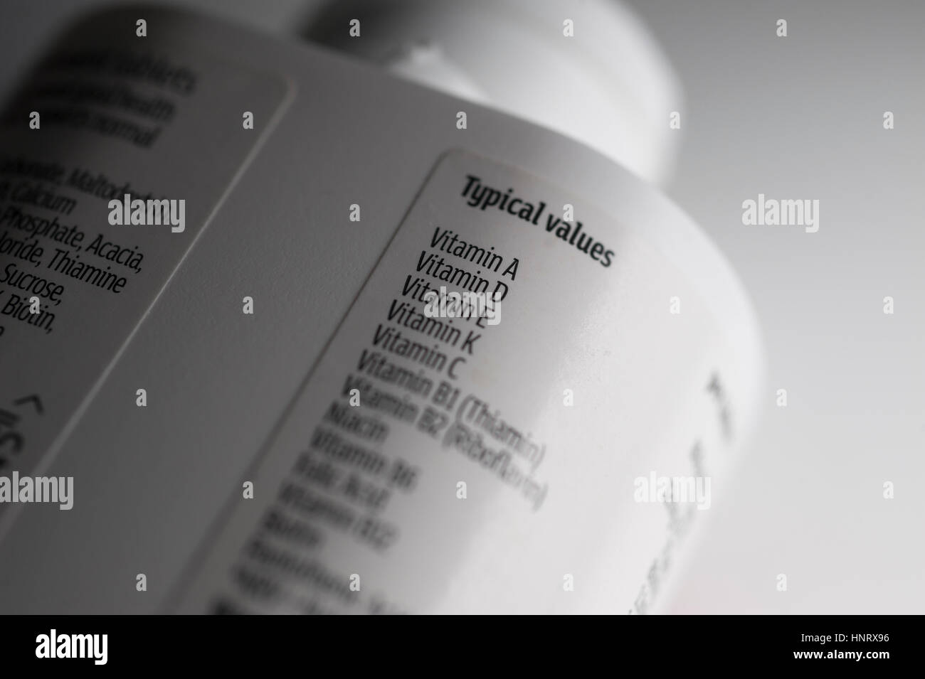 Plastic vitamin supplement bottle label with ingredient list Stock