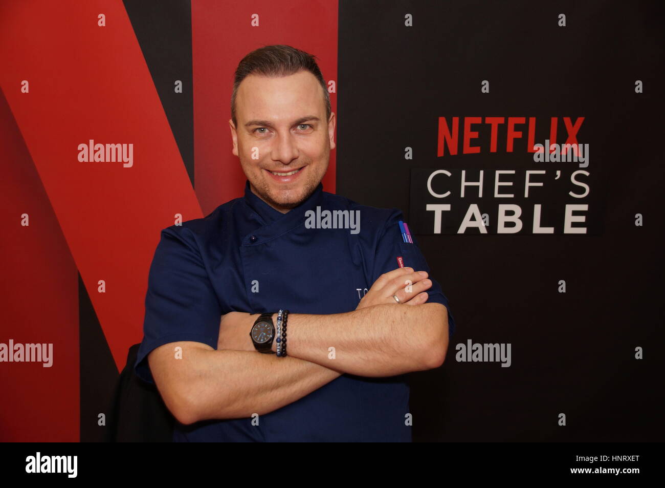 Berlin, Germany. 15th Feb, 2017. Berlin-based chef Tim Raue poses in front  of a poster of the Netflix series 'Chef's Table' at the Ritz-Carlton Hotel  in Berlin, Germany, 15 February 2017. The