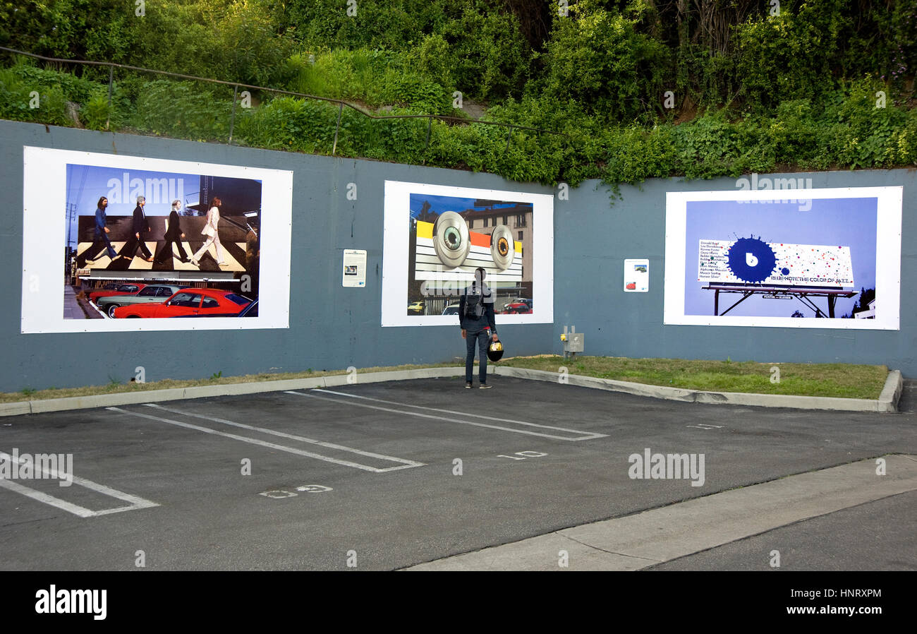 Los Angeles, USA. 14th February 2017. New installation of outdoor art exhibit at the West Hollywood parking lot on the Sunset Strip in Los Angeles featuring Robert Landau's photos documenting the classic hand-painted rock billboards from the 1960s and 70s. Credit: Robert Landau/Alamy Live News Stock Photo