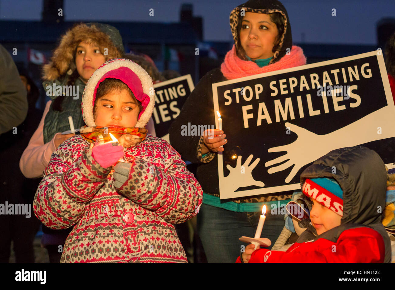 Detroit, Michigan, USA. 15th February 2017. People rally outside Western International High School against deportations of immigrants and against plans to expand the wall on the Mexican border. The vigil was organized by a coalition of Muslim, Jewish, and Hispanic organizations. Credit: Jim West/Alamy Live News Stock Photo