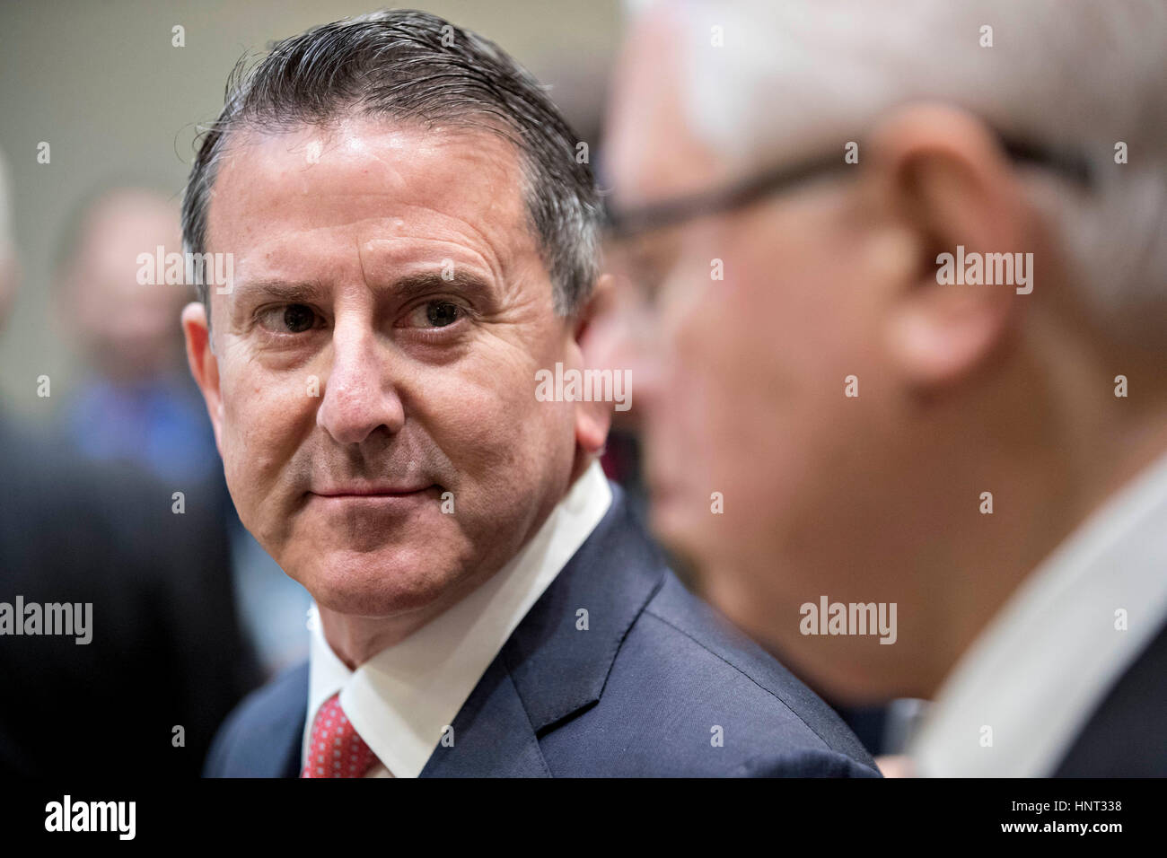 Brian Cornell, chief executive officer of Target Corp., left, waits to begin a listening session with U.S. President Donald Trump, not pictured, and Retail Industry Leaders Association and member company chief executive officers in the Roosevelt Room of the White House in Washington, DC, U.S., on Wednesday, Feb. 15, 2017. Questions about ties between Trump's team and Russian intelligence agents mounted Wednesday after new reports of extensive contacts between the two, which are sure to fuel Republican calls for a deeper look at Trump's links to the country. Credit: Andrew Harrer/Pool via C Stock Photo