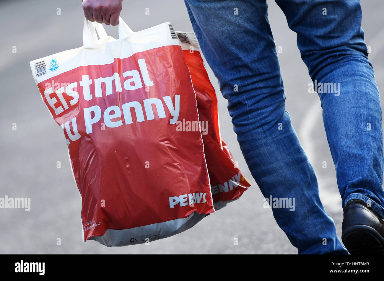 Potsdam Germany 16th Feb 17 Illustration A Man Carries Two Stock Photo Alamy
