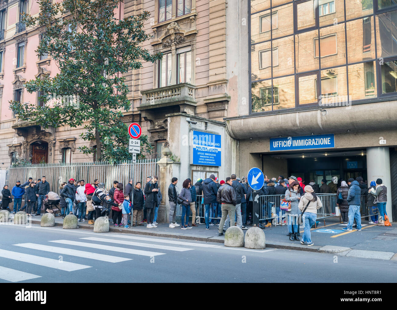 A queue for the Immigration Office in Milan, Italy. Italy is facing a refugee crisis due to ongoing wars in North Africa and the Middle East Stock Photo