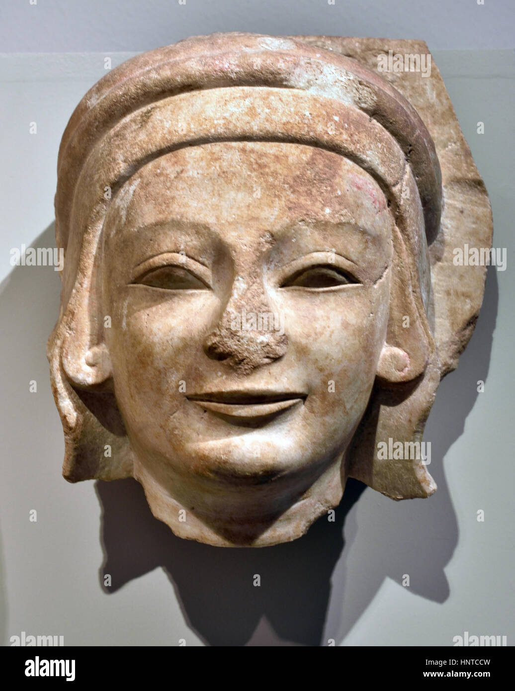 Fragment of a column caelata : Female relief head 540 BC Apollo Temple (Turkey / Didyma) Marble Height :28  cm, head from column Greek, Stock Photo