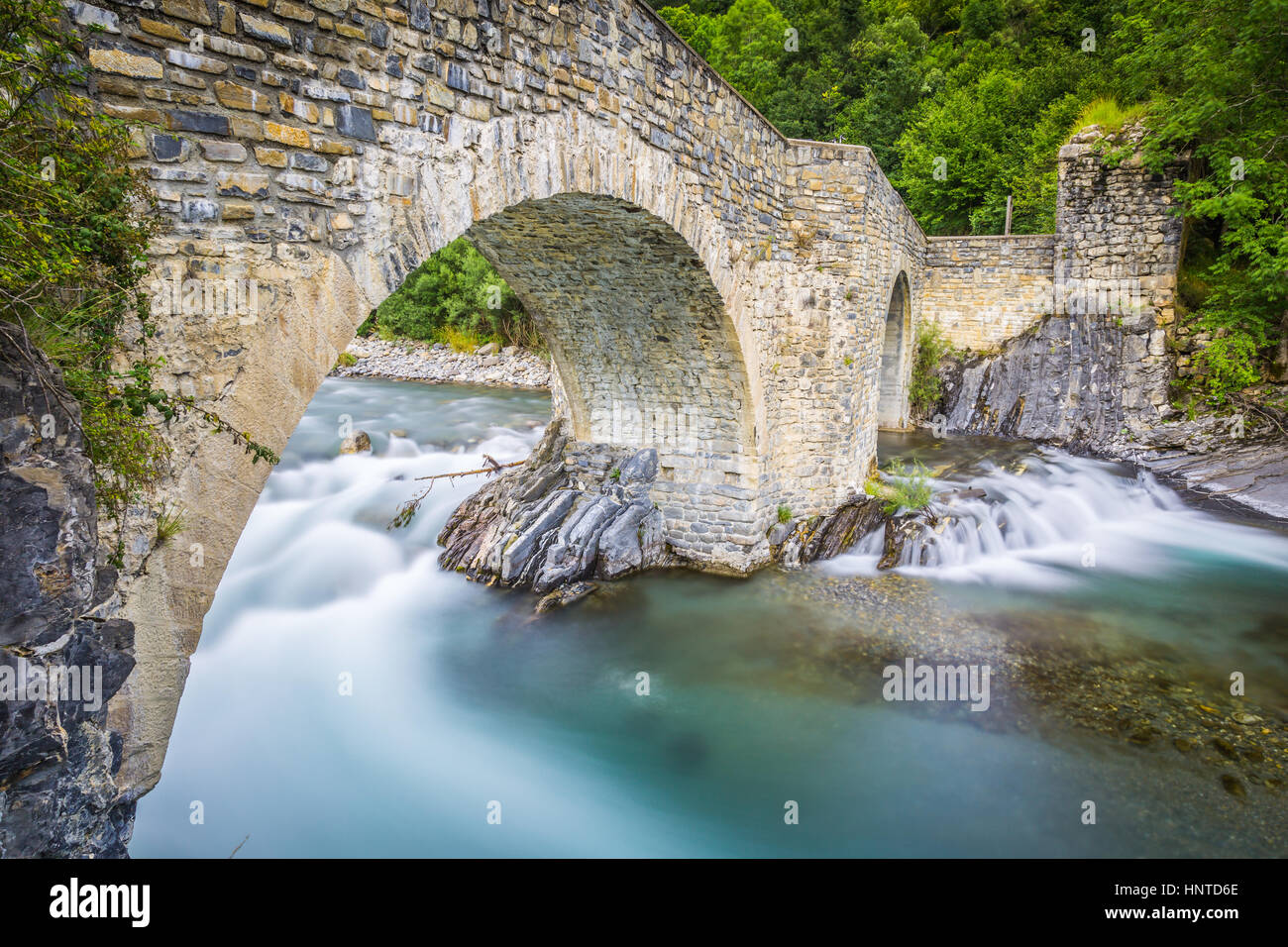 View of old stone bridge over river Stock Photo - Alamy