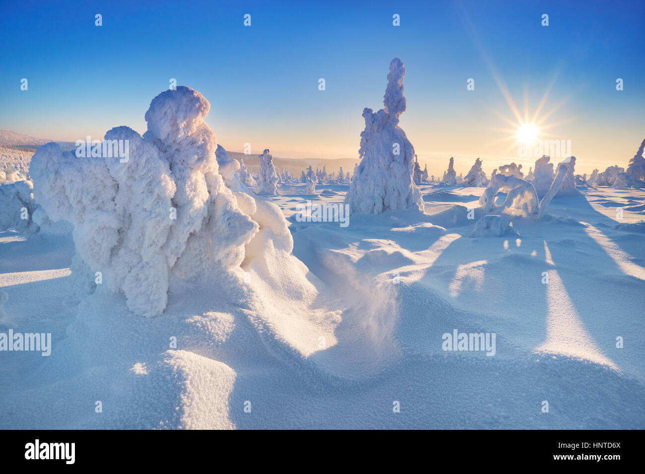 Winter snow scenery at sunset time, Karkonosze Mountains, Poland Stock Photo