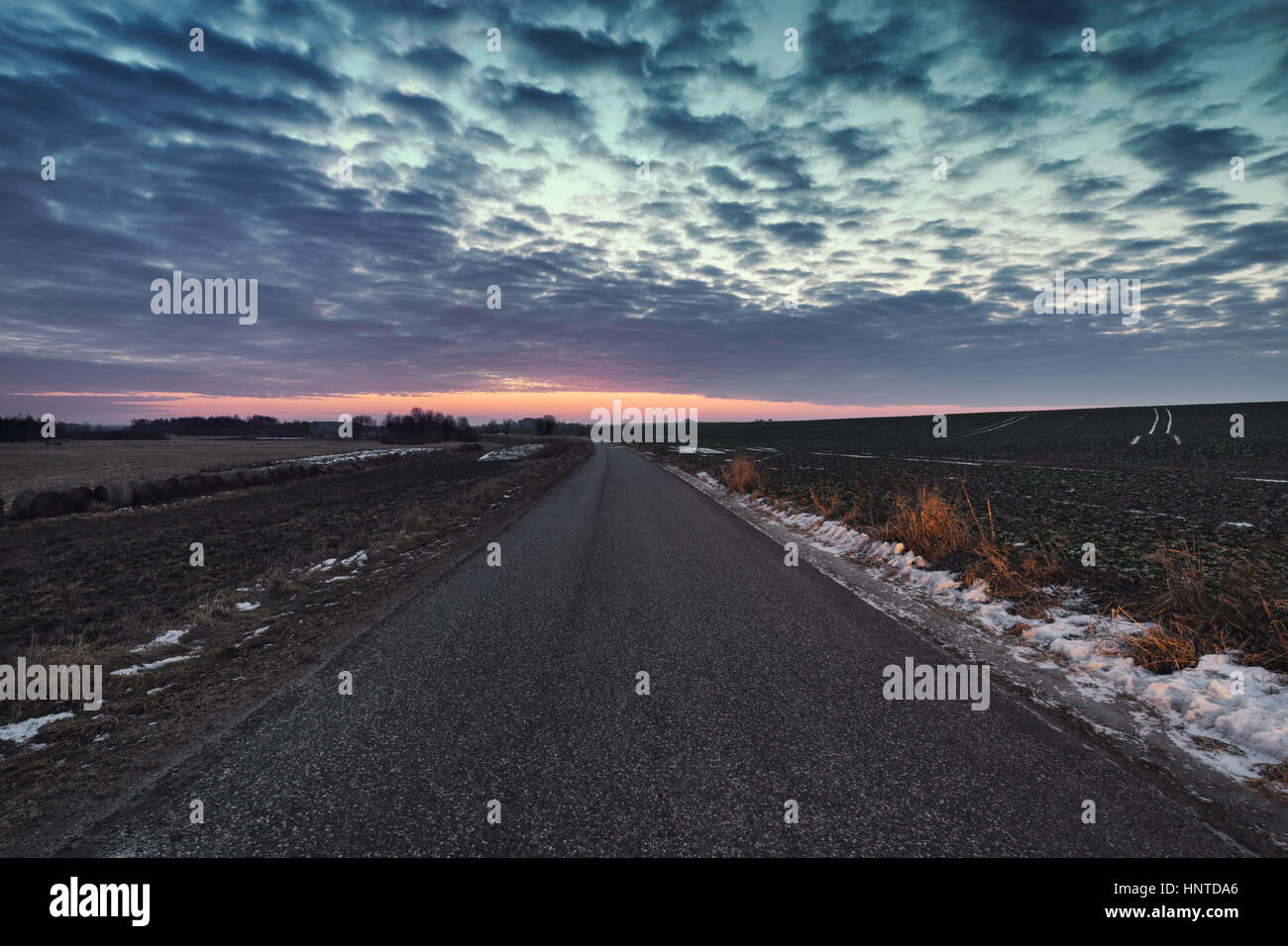 Winter Twilight Sky over Empty Asphalt Road in East Europe Stock Photo
