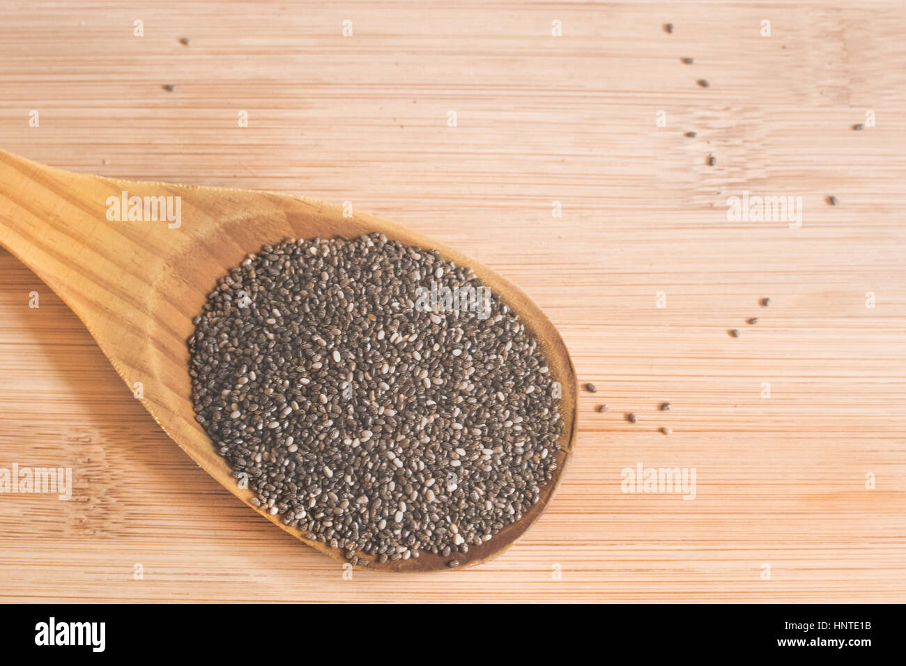 heaped spoon of chia seeds Stock Photo Alamy
