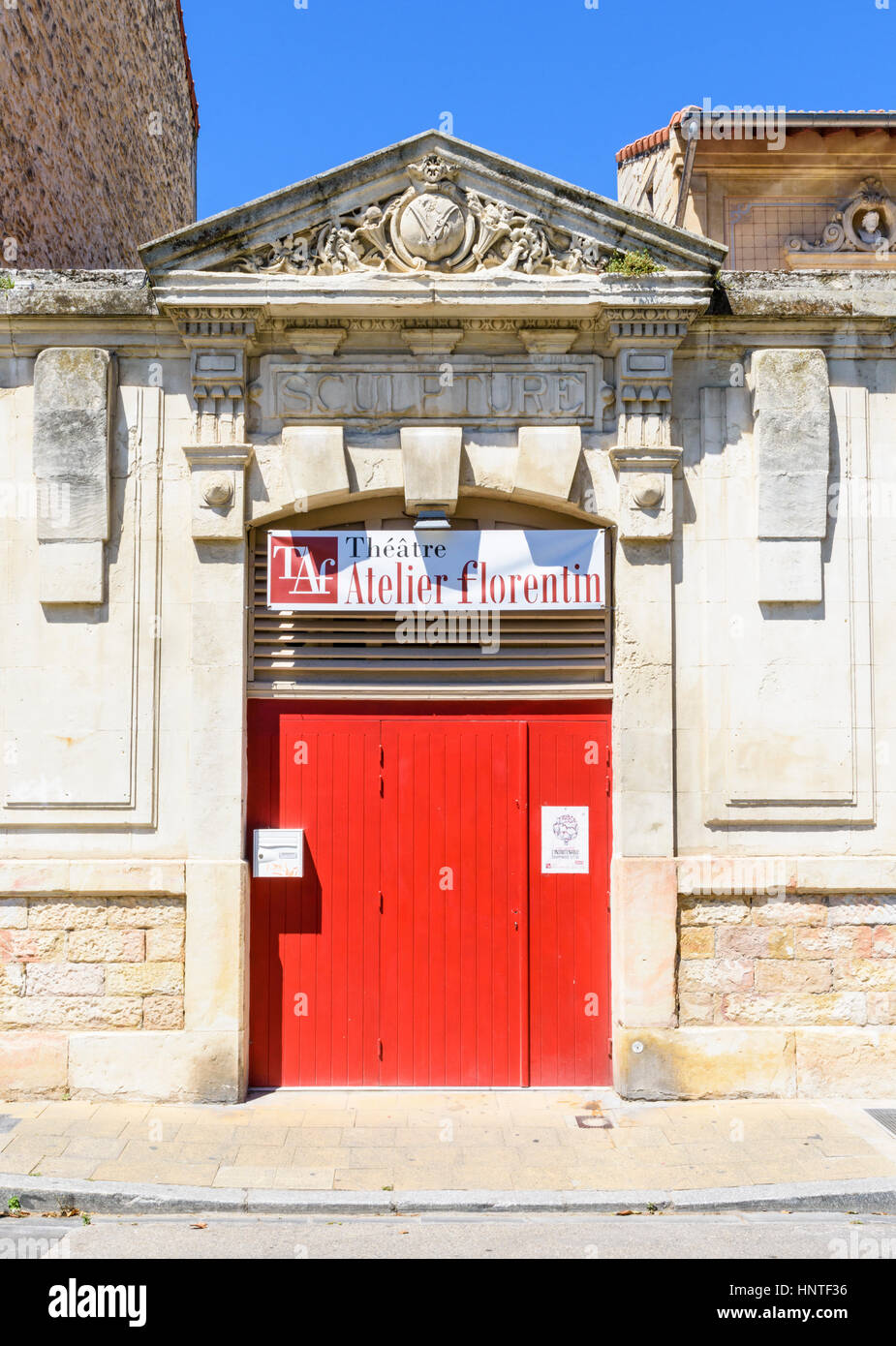 Small doorway and entrance facade of the Theatre Atelier Florentin along rue Guillaume Puy, Avignon, France Stock Photo