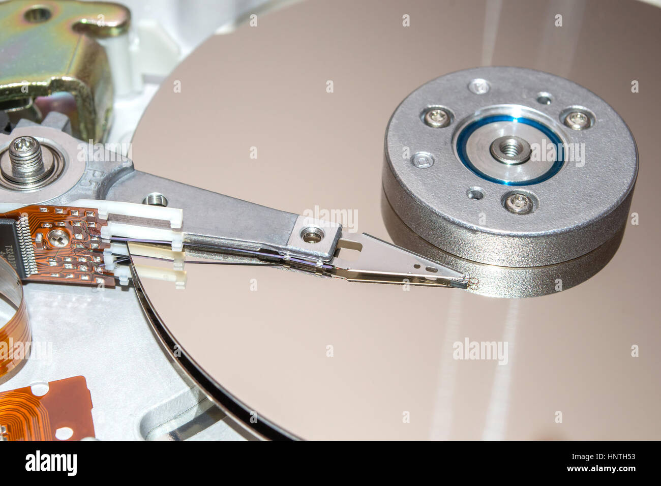 Closeup of inside of a hard disk drive. HDD Stock Photo