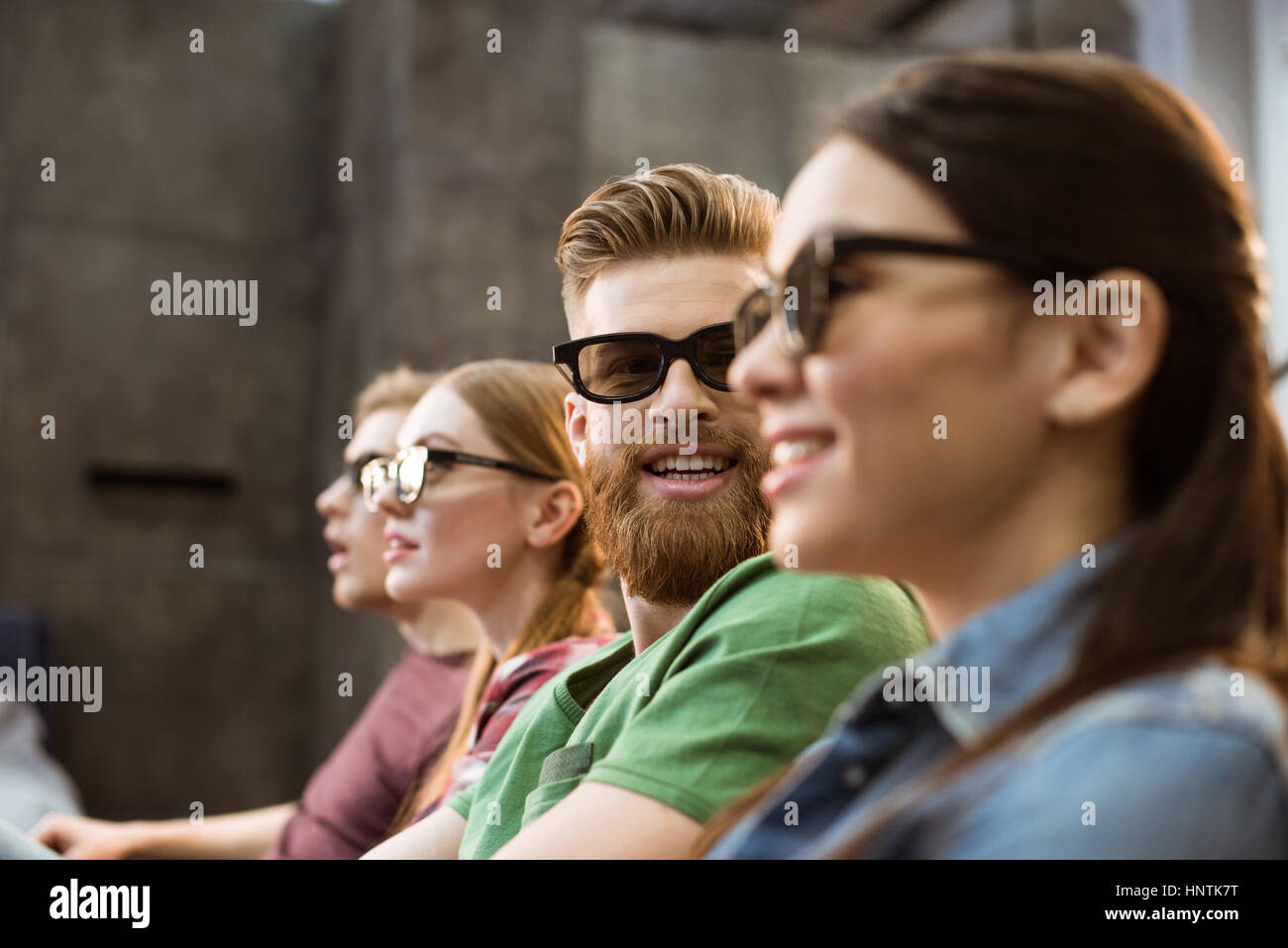 Happy friends watching movie in hi-res stock photography and images - Alamy