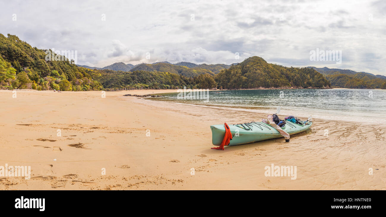 Kayak lying on the beach, Anchorage Bay, Abel Tasman National Park, Tasman Region, Southland, New Zealand Stock Photo
