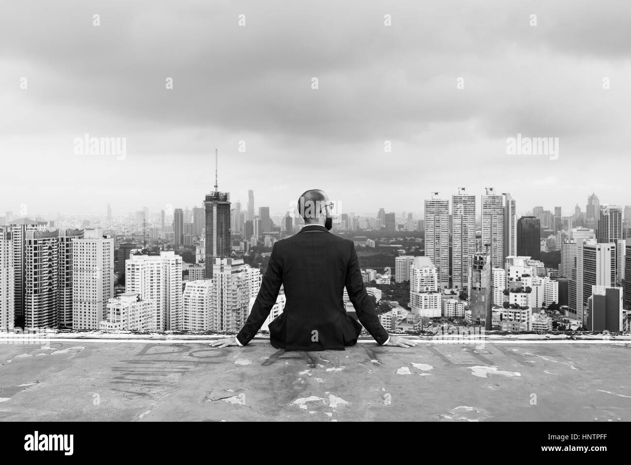 Business Person Sitting Rooftop Concept Stock Photo