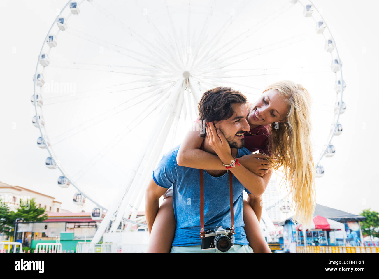 Sweet couple piggyback ride togetherness Stock Photo - Alamy