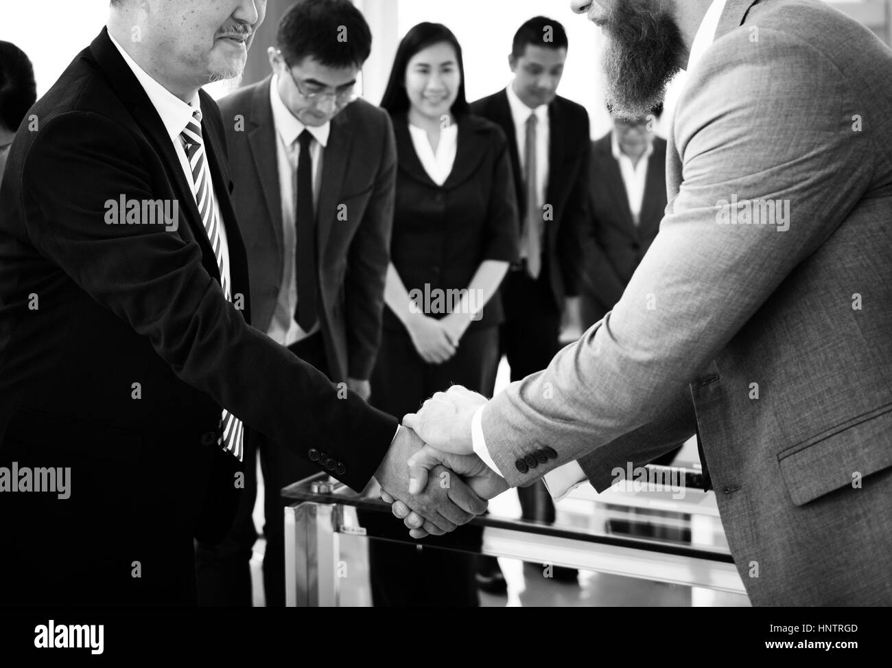 Business Partners Introductionary Handshake Bow Stock Photo