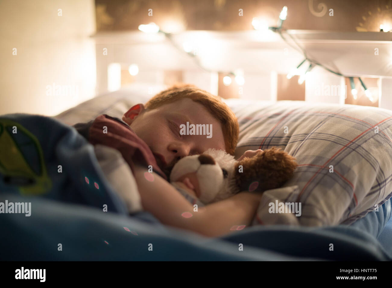 A child asleep in bed Stock Photo