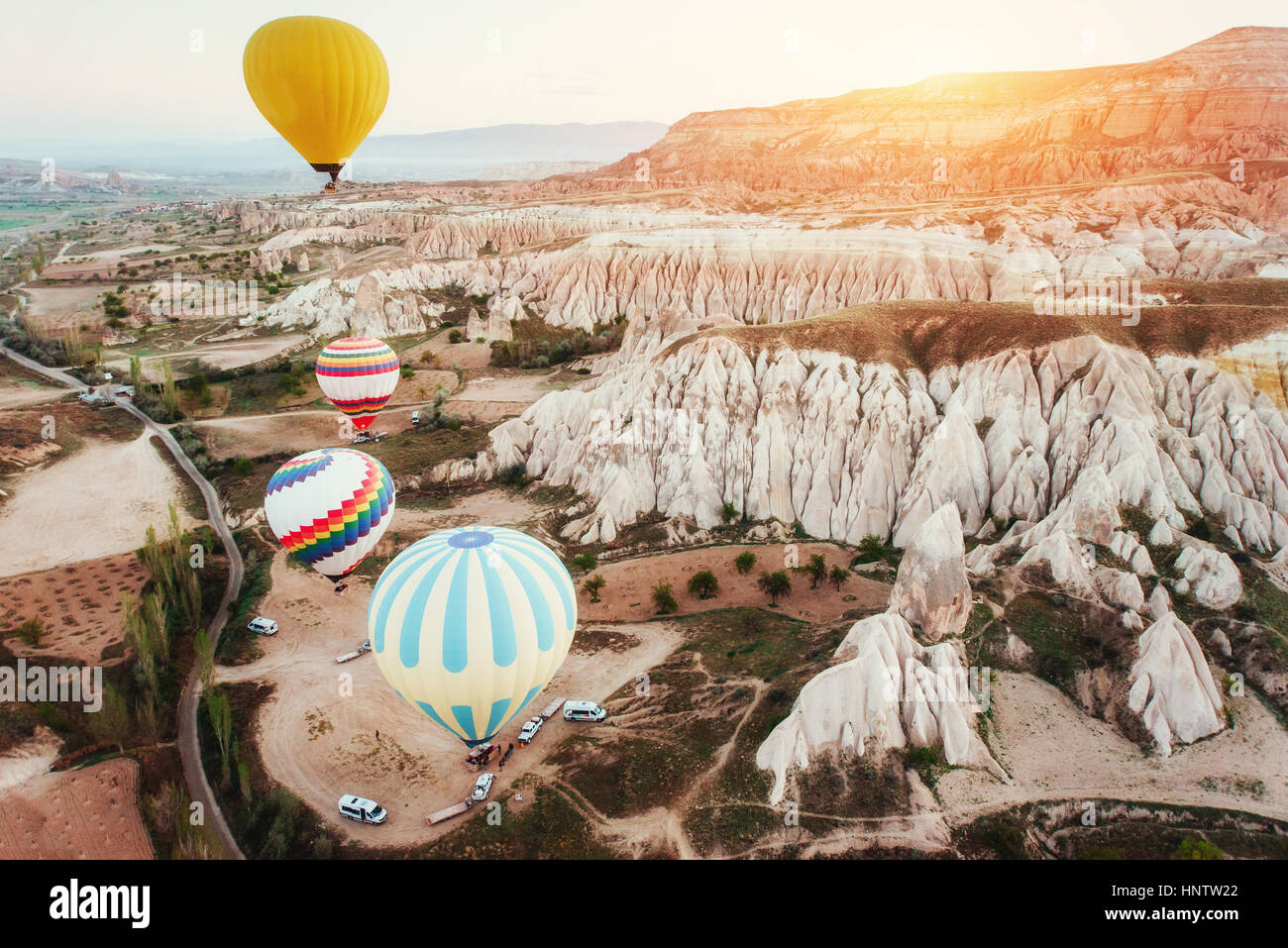Colorful hot air balloons flying over Red valley at Cappadocia Stock ...