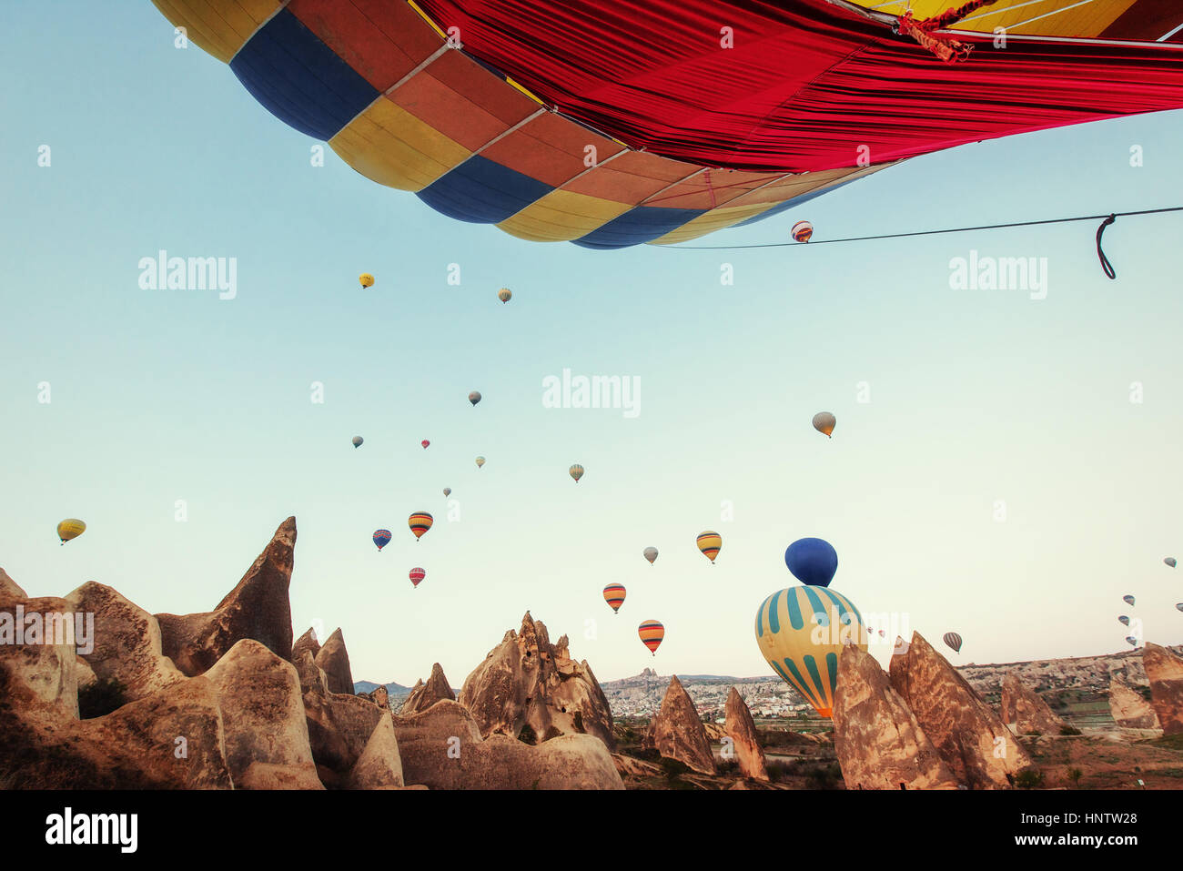 Colorful hot air balloons flying over Red valley at Cappadocia Stock ...