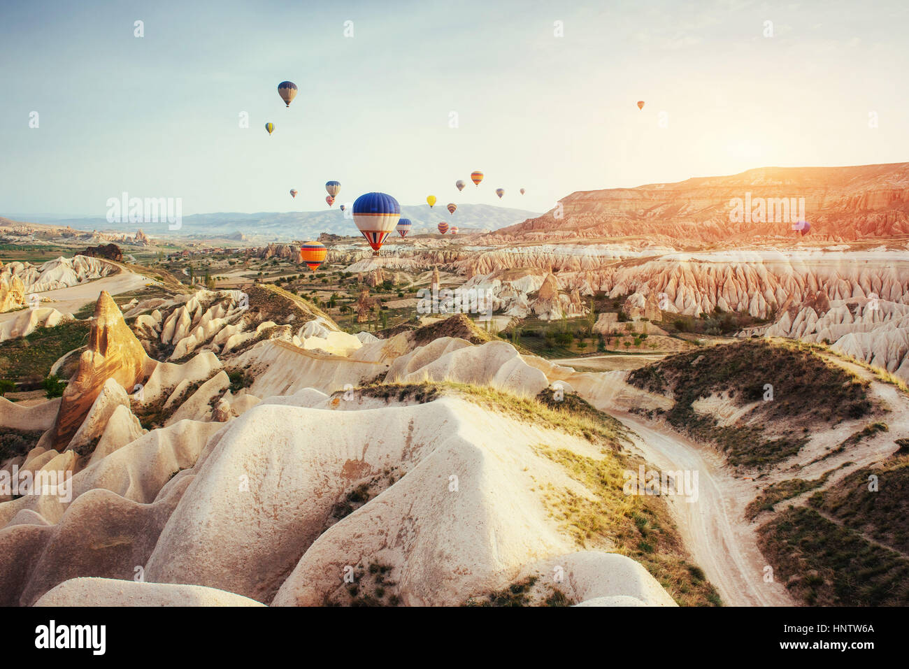 Hot air balloon flying over rock landscape at Cappadocia Turkey Stock ...