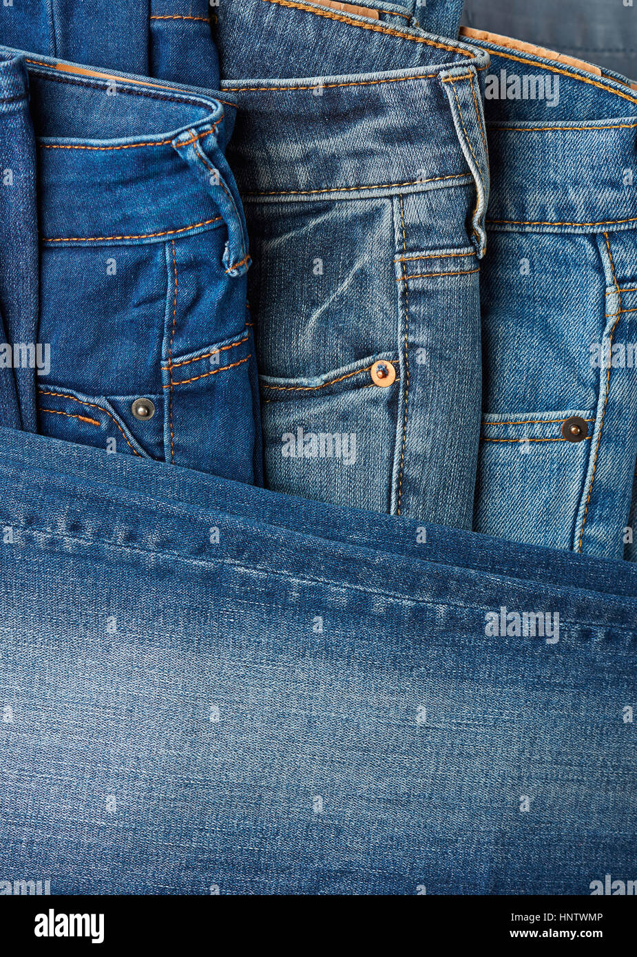 close up of different jeans pants background Stock Photo