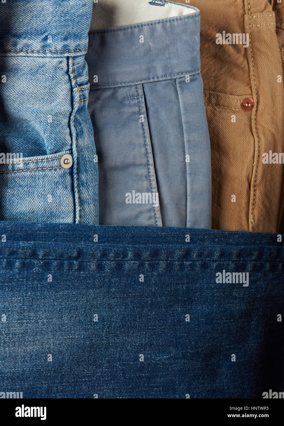 Close up of jeans stack blue and brown color Stock Photo