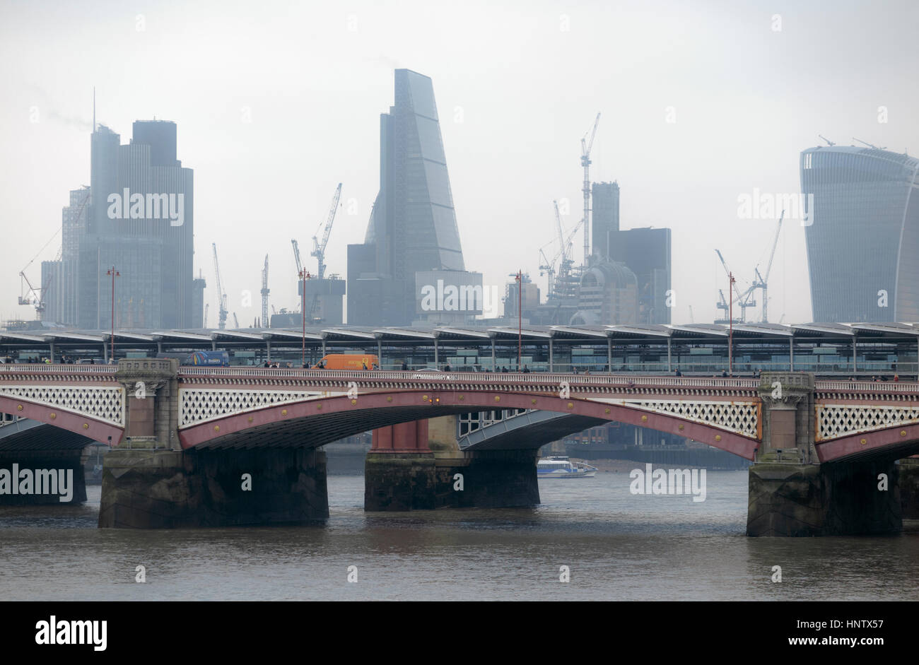 Tower 42, Cheesegrater, Walkie Talkie, iconic skyscrapers on the City of London financial district skyline and Blackfriars Bridge on a dreary morning Stock Photo