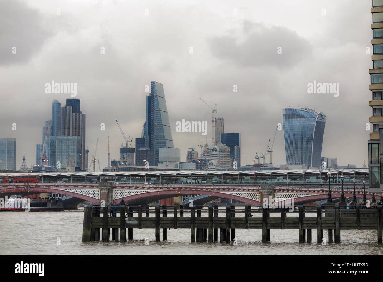 Tower 42, Cheesegrater, Walkie Talkie, iconic skyscrapers on the City of London financial district skyline and Blackfriars Bridge on dismal afternoon Stock Photo