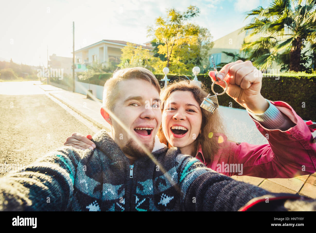 Happy couple showing their new house keys Stock Photo - Alamy