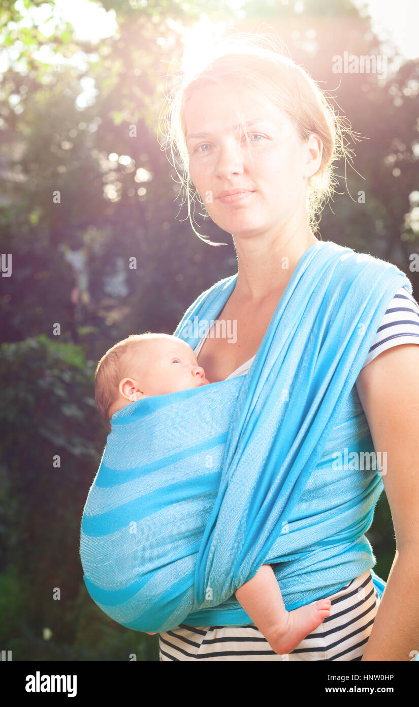 Women carrying her baby in a baby carrier hi-res stock photography and  images - Alamy
