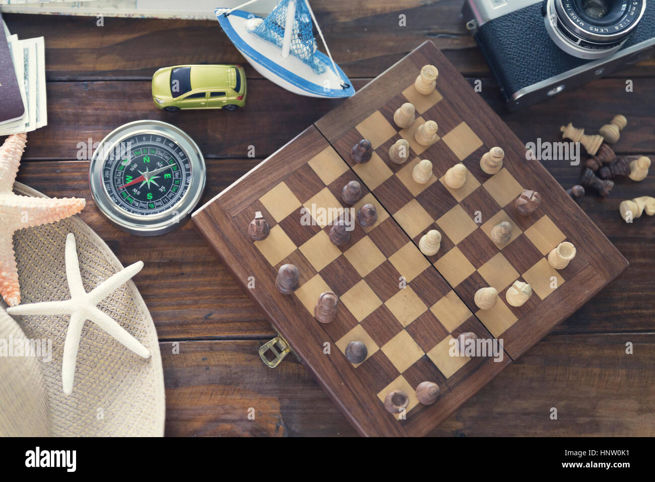 compass, chessboard, hat, passport, banknote money, camera, map