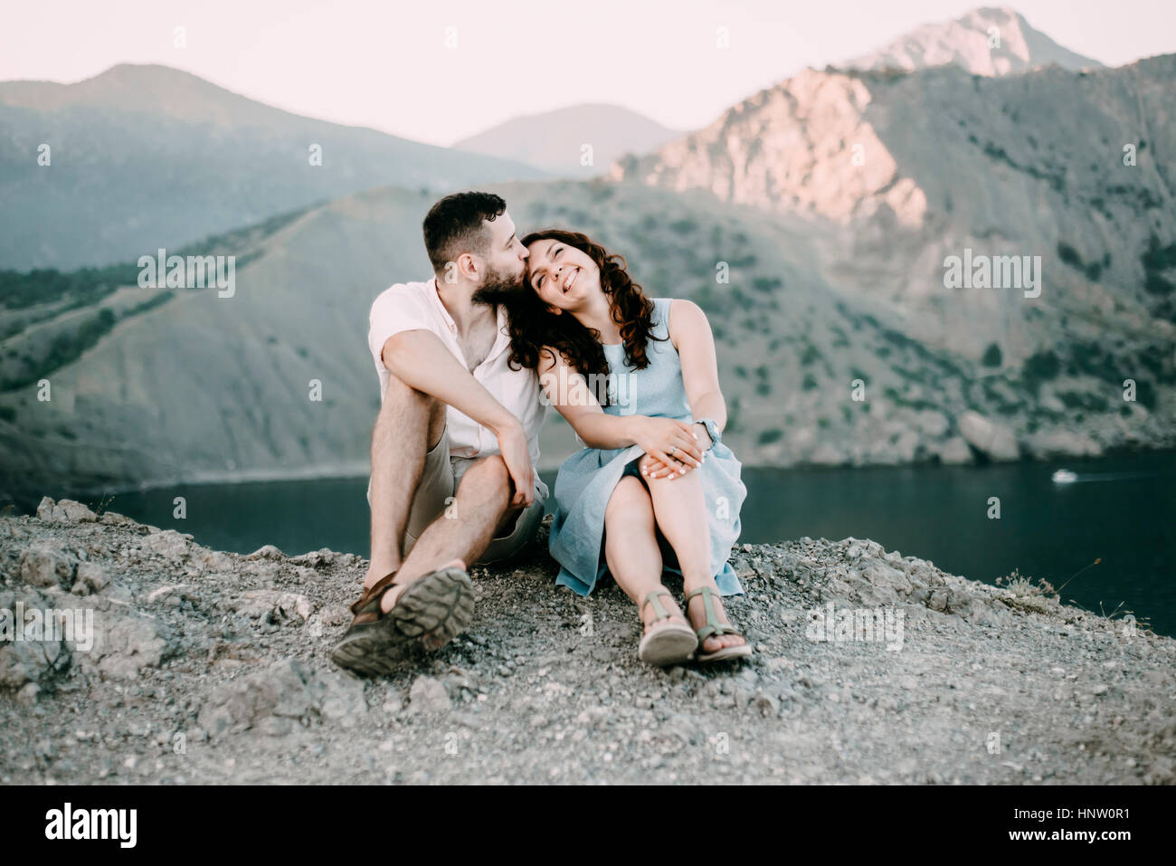 Man and woman kissing hi-res stock photography and images - Alamy