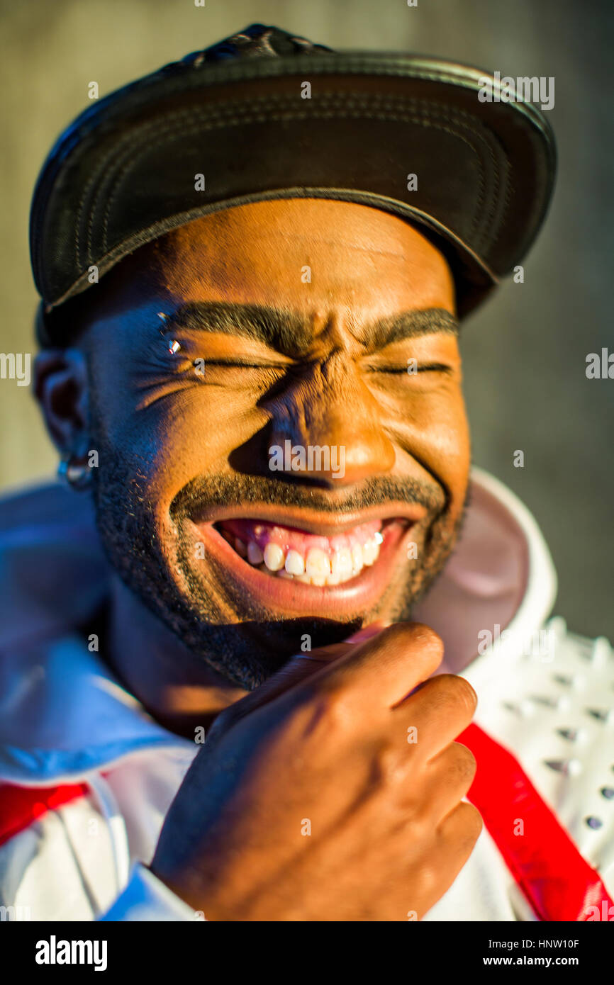 Black man laughing with eyes closed Stock Photo Alamy