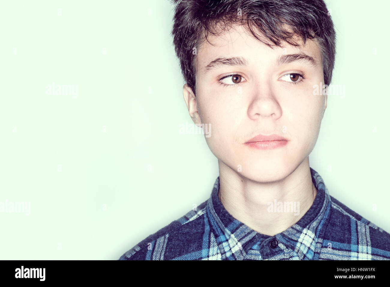 Portrait of serious Caucasian teenage boy Stock Photo
